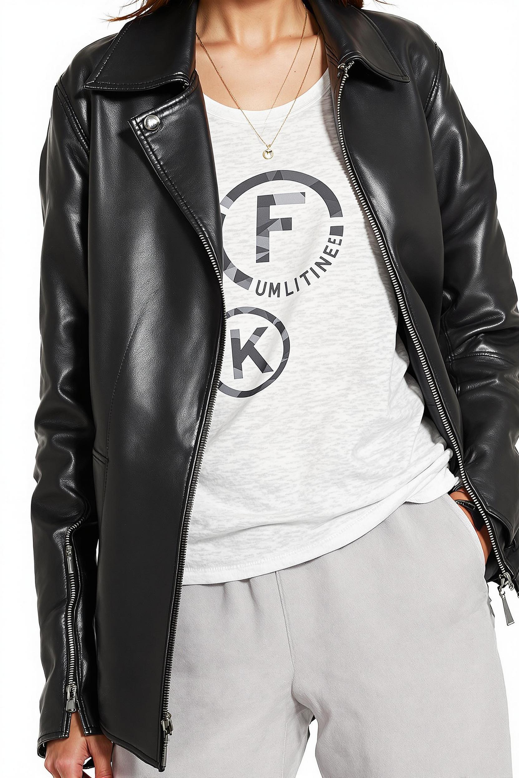 Oversized⁣ vegan ⁣leather jacket layered over a graphic tank and wide-leg pants